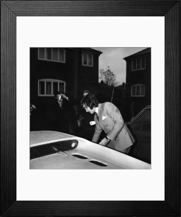 Framed Print : Manchester United star George Best leaving the house to go to the match against