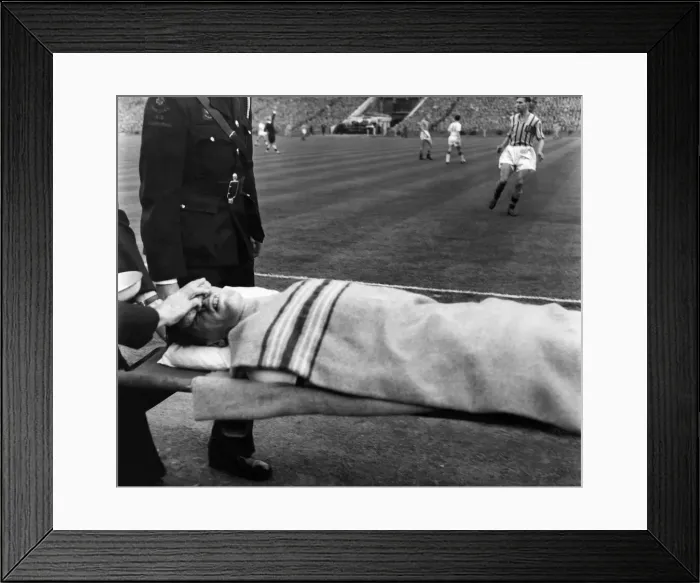 Framed Print : Wood, R. Play continues whilst ambulance men trying to stop the bleeding from his nose is Framed Print : Wood, R. Play continues whilst ambulance men trying to stop the bleeding from his nose is