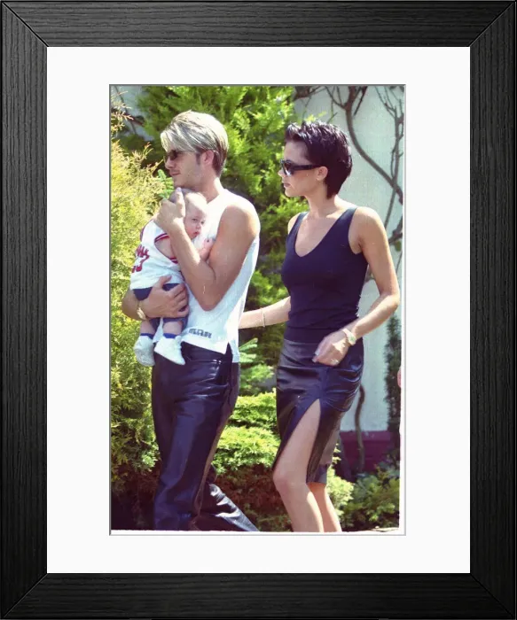 Framed Print : David Beckham and Posh Spice with baby Brooklyn July 1999 outside their home two days Framed Print : David Beckham and Posh Spice with baby Brooklyn July 1999 outside their home two days