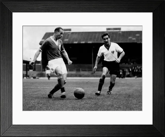 Framed Print : 42-years-young Stan Matthews waltzes round Hugh Kelly in Blackpool Framed Print : 42-years-young Stan Matthews waltzes round Hugh Kelly in Blackpool