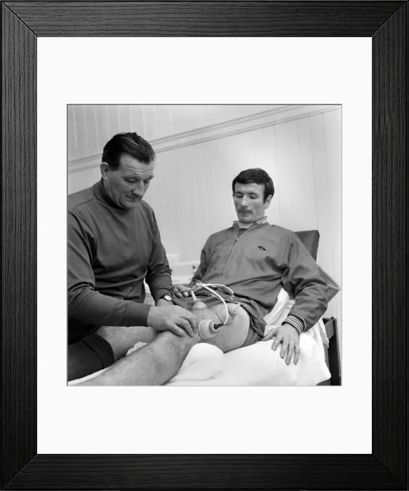 Framed Print : Injured Liverpool player Tommy Smith receives treatment from Bob Paisley in the treatment Framed Print : Injured Liverpool player Tommy Smith receives treatment from Bob Paisley in the treatment