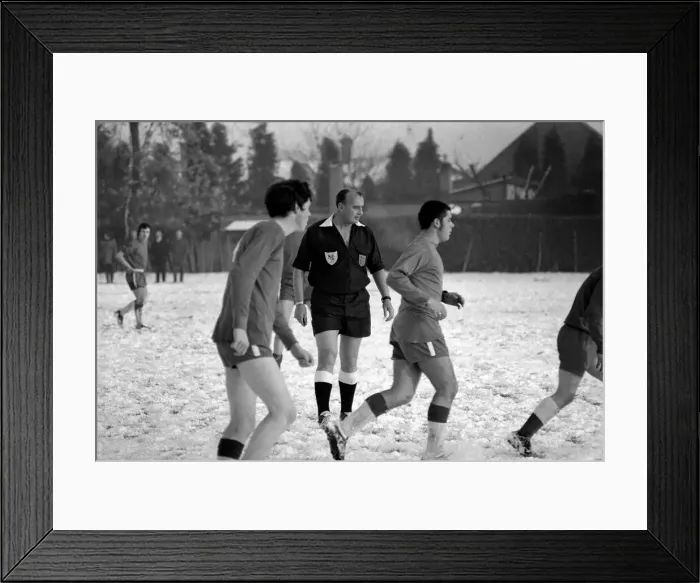 Framed Print : Sport Amateur football youth game in action in the snow near Maidshow between two local Framed Print : Sport Amateur football youth game in action in the snow near Maidshow between two local