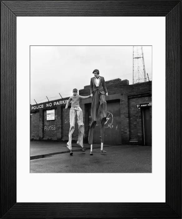 Framed Print : Malcolm Parry, 14, of Gorton, Manchester, is learning stiltwalking with his friend who is Framed Print : Malcolm Parry, 14, of Gorton, Manchester, is learning stiltwalking with his friend who is