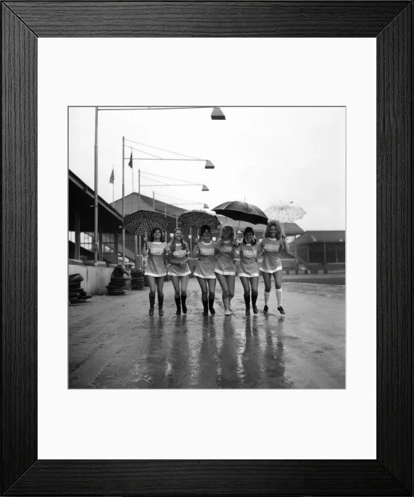 Framed Print : Lined up in their mini soccer dresses at what should have been the time for kick-off are Framed Print : Lined up in their mini soccer dresses at what should have been the time for kick-off are