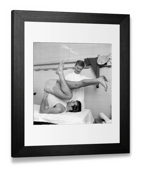 Framed Print : Injured player Johnny Quinn of Rotherham FC exercisingin the treatment room as he