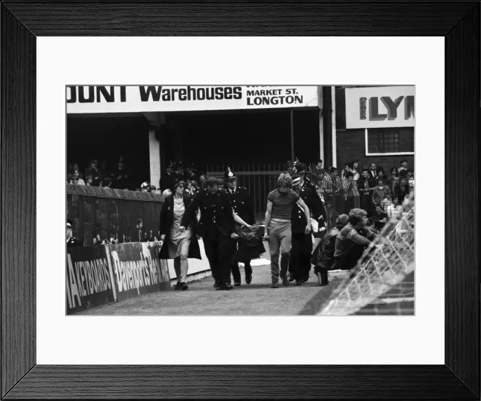 Framed Print : English League Division One match. Stoke City 2 v Arsenal 1 Fan stretchered Framed Print : English League Division One match. Stoke City 2 v Arsenal 1 Fan stretchered