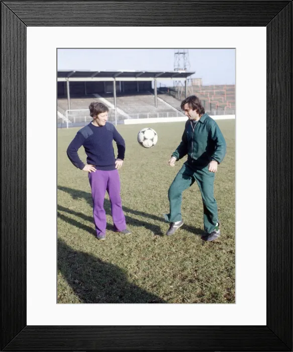 Framed Print : Hibernian footballer George Best practices his ball control watched by coach John Lambie Framed Print : Hibernian footballer George Best practices his ball control watched by coach John Lambie