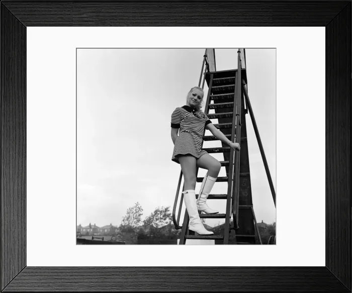 Framed Print : Daily Mirror Autumn Bird Karen Singleton (17) takes a break from working behind Framed Print : Daily Mirror Autumn Bird Karen Singleton (17) takes a break from working behind
