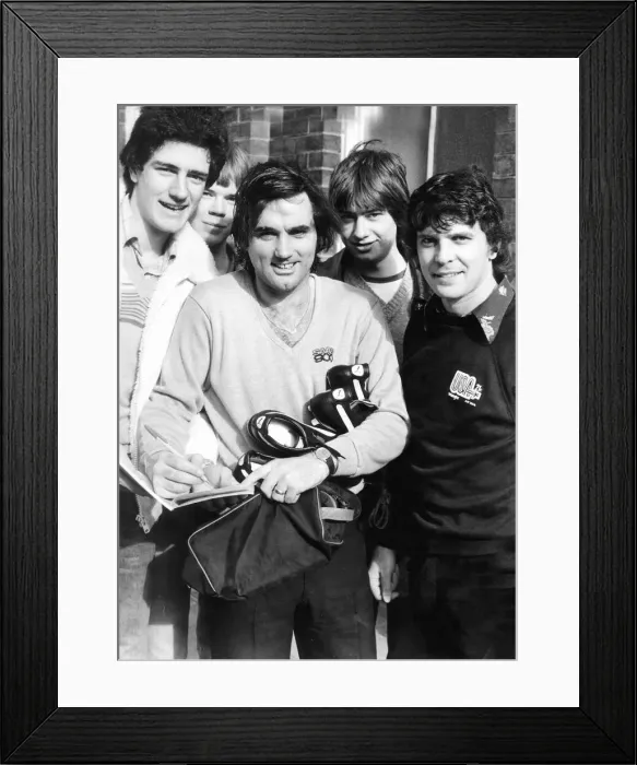 Framed Print : Hibernian footballer George Best signs autographs for fans as Peter Cormack looks on