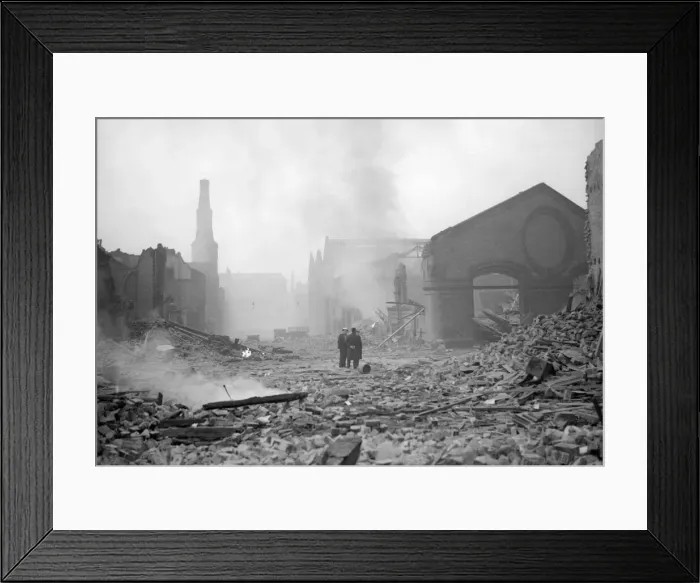 Framed Print : Bomb damage at Liverpool Two people survey the damage caused by the air raid Framed Print : Bomb damage at Liverpool Two people survey the damage caused by the air raid