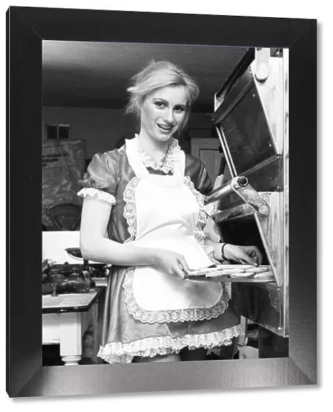 Model Janet Slaven seen here helping putting her mince pies into the oven December 1982