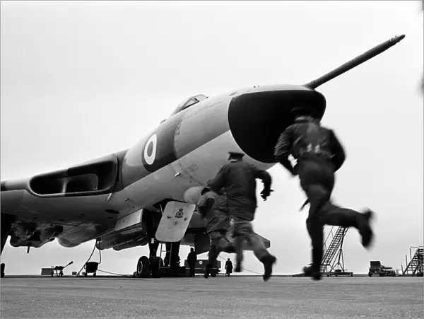 Air crew of 617 Squadron scramble their Avro Vulcan Bomber at RAF Scampton as part of a