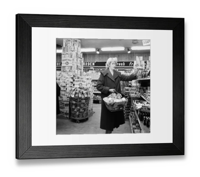 Framed Print : Mrs P Ray seen here shopping at the newly opened supermarket in North Finchley