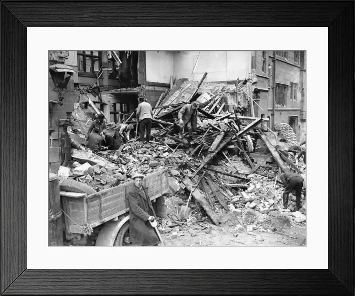 Framed Print : Rescue workers seen here searching through the wreckage of the Police Station in St Mary Framed Print : Rescue workers seen here searching through the wreckage of the Police Station in St Mary