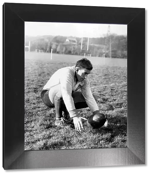 Colin Meads, New Zealand rugby player practising place kicking during a All Blacks