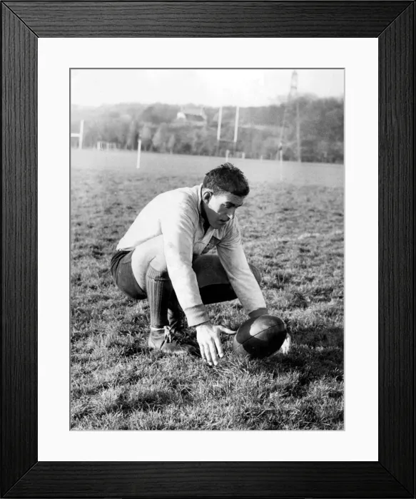 Framed Print : Colin Meads, New Zealand rugby player practising place kicking during a All Blacks