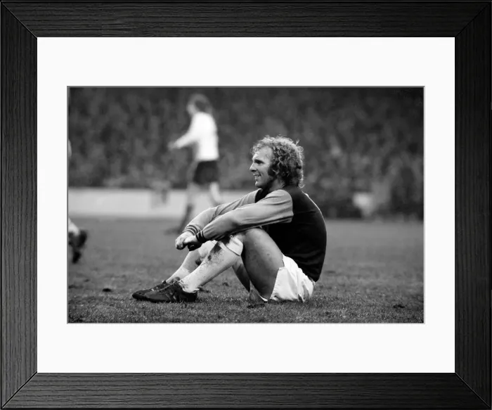 Framed Print : West Ham vs. Liverpool: Bobby Moore takes a rest during an injury to a Liverpool player Framed Print : West Ham vs. Liverpool: Bobby Moore takes a rest during an injury to a Liverpool player