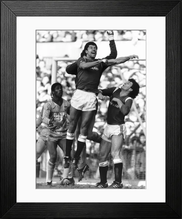 Framed Print : Paul McGrath of Manchester United jumps up for a high ball during his side Framed Print : Paul McGrath of Manchester United jumps up for a high ball during his side