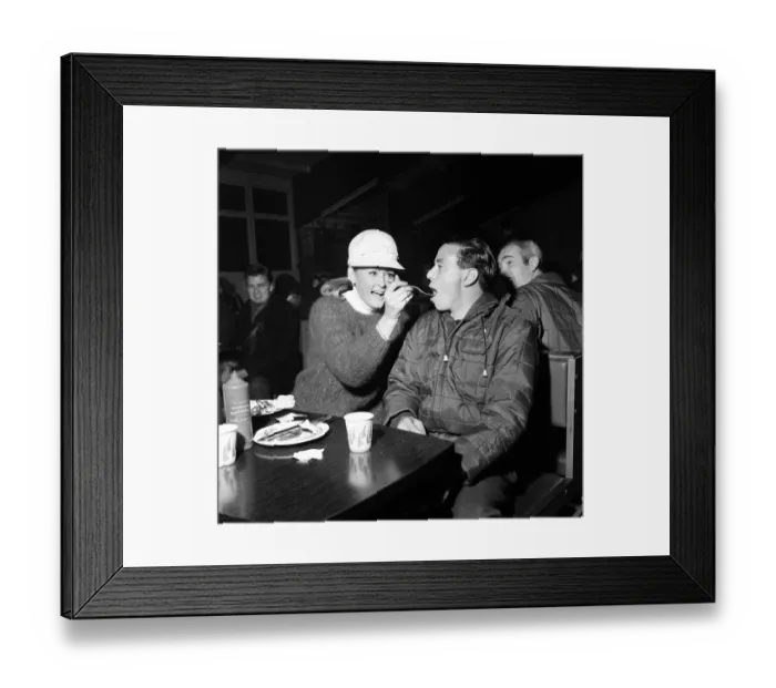 Framed Print : A hungry Jim Clark Racing Driver competing in the 1966 RAC Rally around Britain is fed a Framed Print : A hungry Jim Clark Racing Driver competing in the 1966 RAC Rally around Britain is fed a
