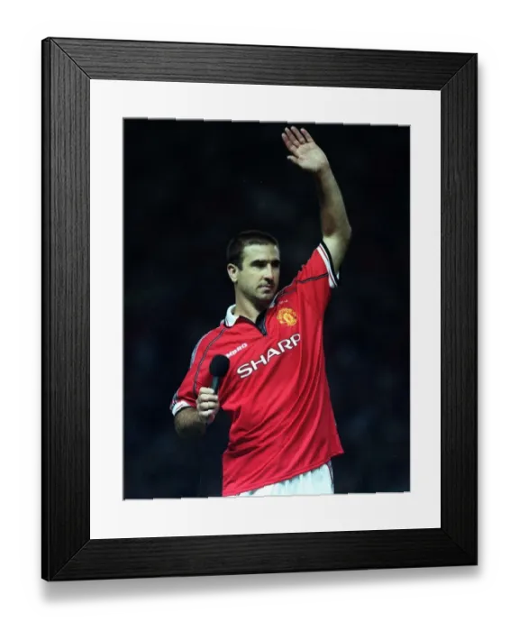 Framed Print : Eric Cantona waving to Manchester United fans Holding microphone after Munich