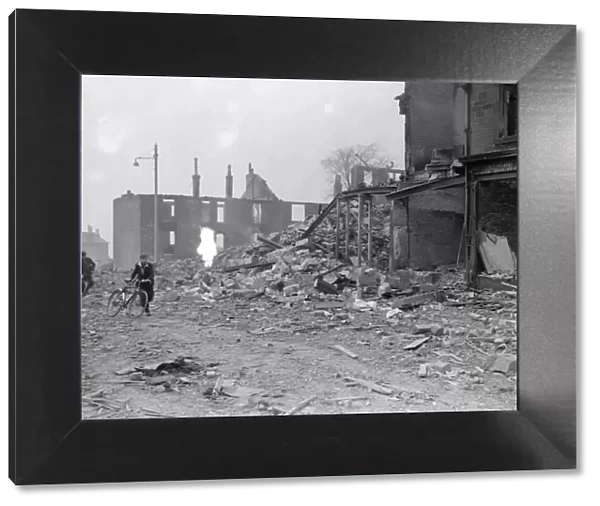 Bomb damage at Glasgow Clydeside, two boys runs for safety during the blitz