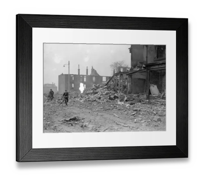Framed Print : Bomb damage at Glasgow Clydeside, two boys runs for safety during the blitz