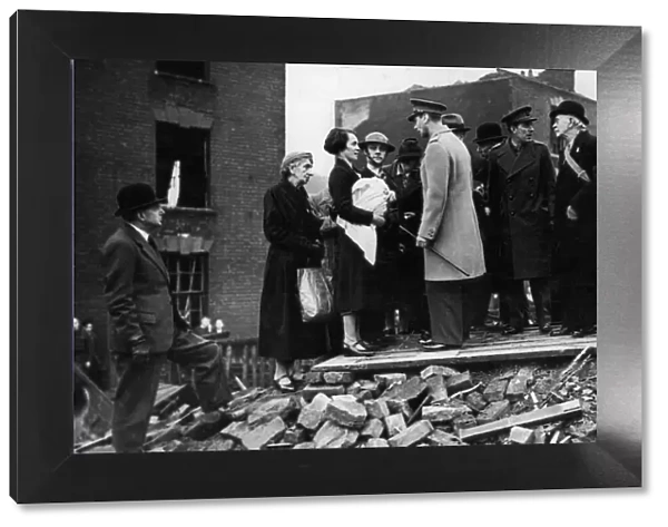 King George VI meets residents of a bombed street during his visit to the city of