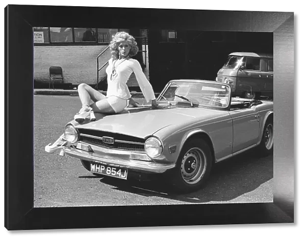 Reveille model Nicky Howarth seen here posing with a TR6 car which is top prize in