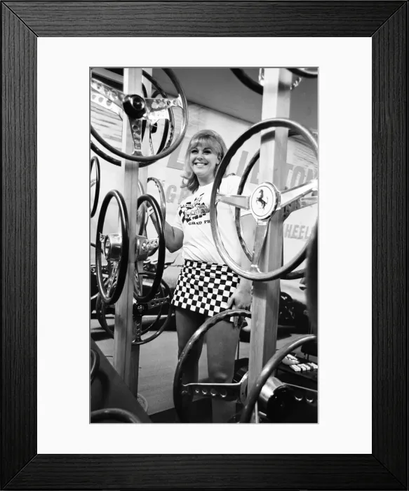 Framed Print : Model poses with steering wheels on a stand at the 1966 London Motor Show 18th October Framed Print : Model poses with steering wheels on a stand at the 1966 London Motor Show 18th October