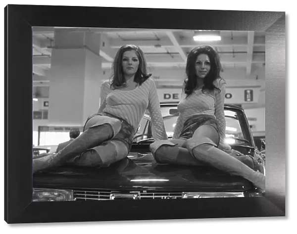Two models draped over the bonnet of a car at the 1971 Earls Court motor show 19th