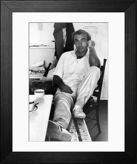 Framed Print : Cricketer John Edrich nurses his injured leg after batting in today Framed Print : Cricketer John Edrich nurses his injured leg after batting in today