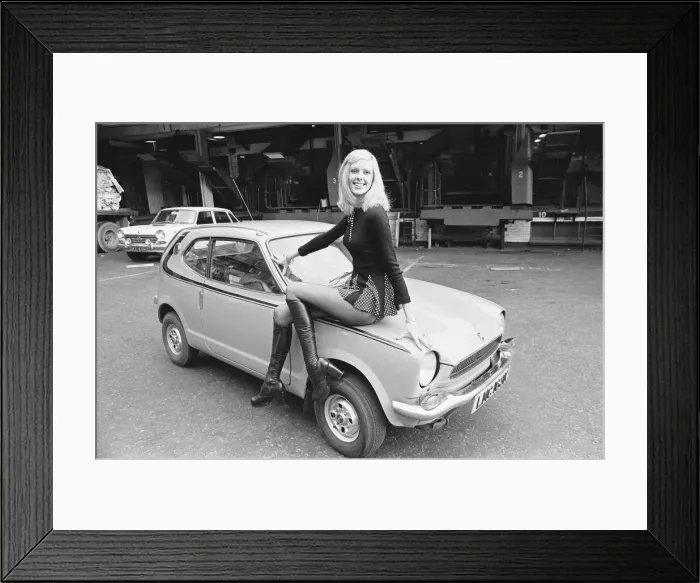 Framed Print : Reveille model Krista seen here posing with a Honda Civic car which is a top prize in Framed Print : Reveille model Krista seen here posing with a Honda Civic car which is a top prize in