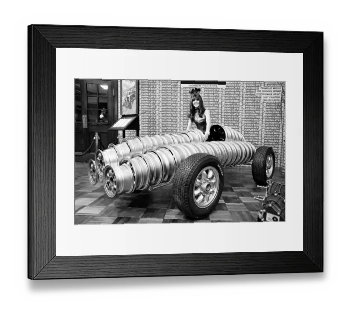 Framed Print : Model drapped over car made from wheels at Motor Show at Horticultural Hall 2nd January Framed Print : Model drapped over car made from wheels at Motor Show at Horticultural Hall 2nd January