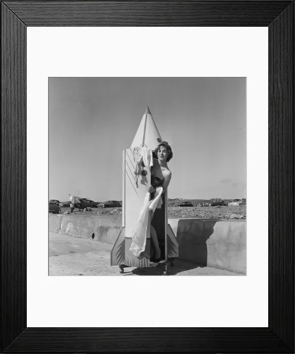 Framed Print : A woman tries out a new bathing machine at the Water Spalsh beach at St Framed Print : A woman tries out a new bathing machine at the Water Spalsh beach at St