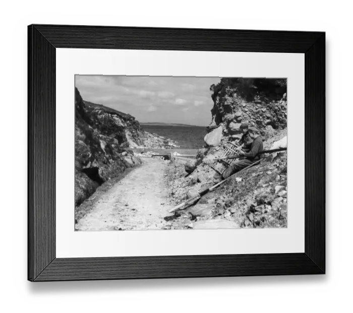 Framed Print : Fishermen seen here on Achill Island County Mayo Ireland repairing their lobster pots