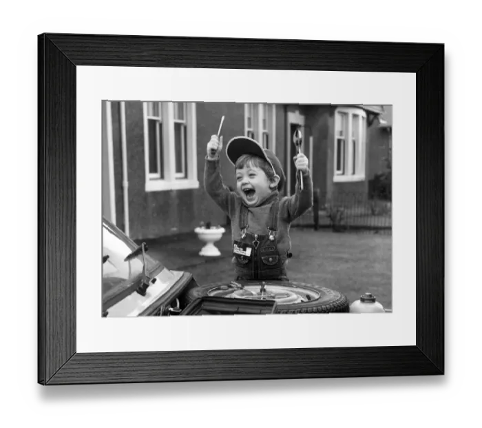 Framed Print : 2 year old car enthusiast Stuart Douglas with his tools. 25th January 1980