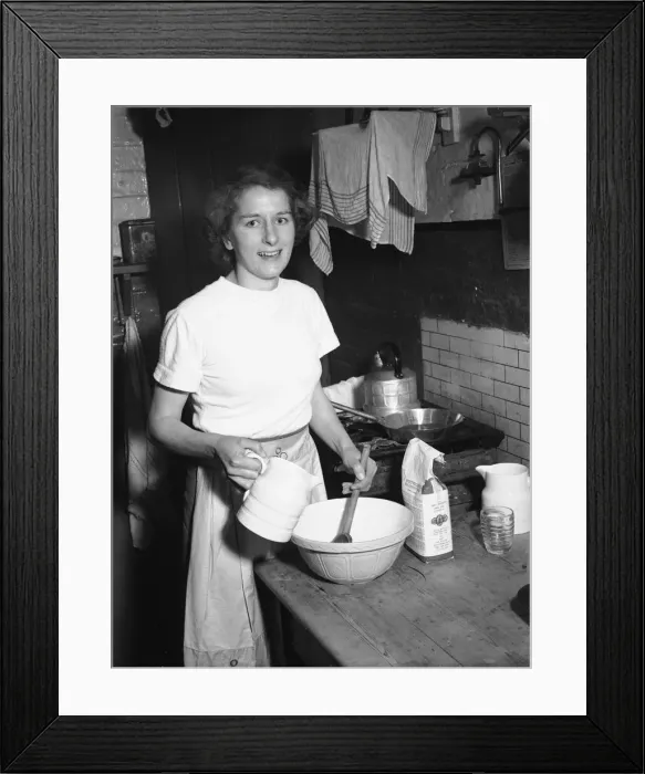 Framed Print : Woman seen in the kitchen baking Circa February 1952 Framed Print : Woman seen in the kitchen baking Circa February 1952