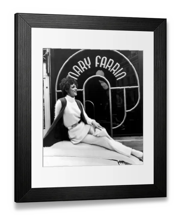Framed Print : Fashion designer Mary Farrin wearing her own white knitted angora dress over matching