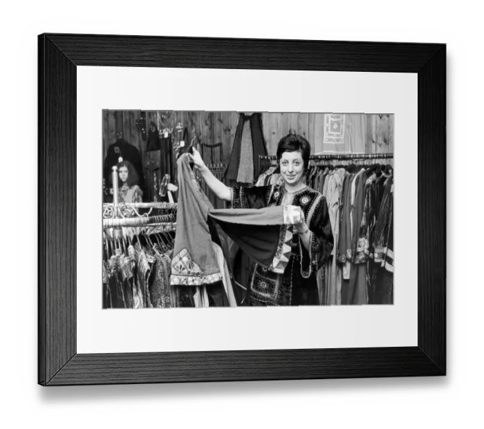 Framed Print : Betty Van Gelder, owner of a dress shop in Hampstead, wearing one of her own velvet Framed Print : Betty Van Gelder, owner of a dress shop in Hampstead, wearing one of her own velvet