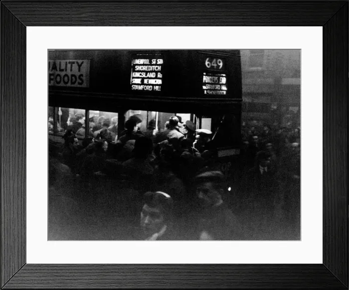 Framed Print : Commuters swarm on to a number 649 bus in Tottenham on a gloomy winters evening Framed Print : Commuters swarm on to a number 649 bus in Tottenham on a gloomy winters evening