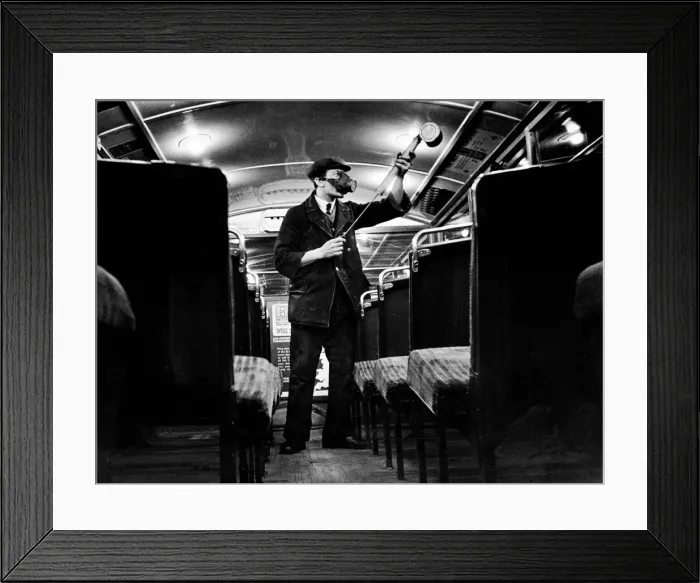 Framed Print : A cleaner seen here spraying a pesticide to kill germs during a routine cleansing of