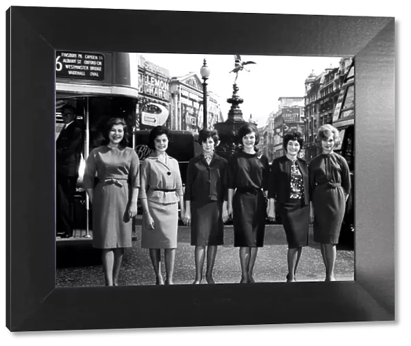 Six girls wearing the latest Marks and Spencer clothes pose at Piccaddilly Circus in