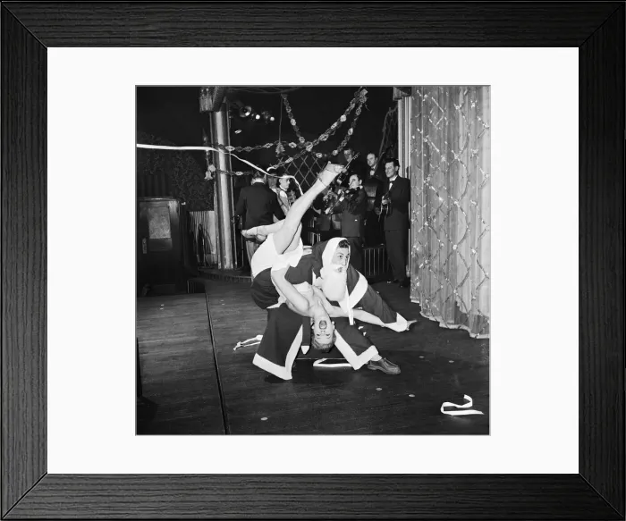 Framed Print : Rock n roll Santa (Roger Palmer) holds the floor with Pamela Bevan at London