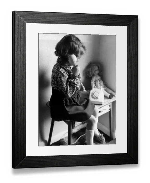 Framed Print : A young girl on the phone. 19th November 1974