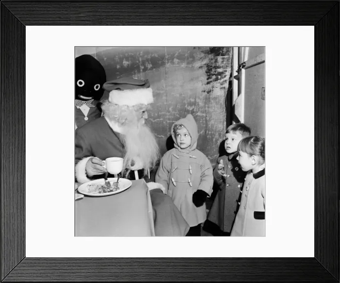 Framed Print : Children watching Father Christmas eating his dinner. 29th December 1955 Framed Print : Children watching Father Christmas eating his dinner. 29th December 1955