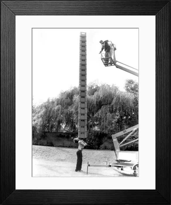 Framed Print : Acrobat Terry Cole, aged 26, breaks his previous record of balancing 16 empty milk crates Framed Print : Acrobat Terry Cole, aged 26, breaks his previous record of balancing 16 empty milk crates
