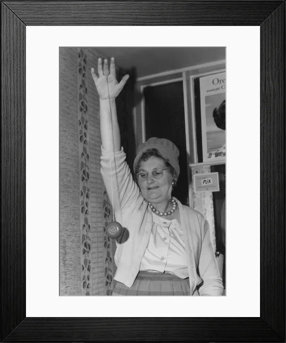 Framed Print : Elderly woman seen here playing with a yo-yo. 6th December 1961 Framed Print : Elderly woman seen here playing with a yo-yo. 6th December 1961