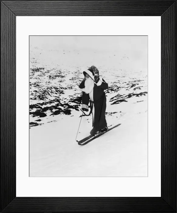 Framed Print : Father Christmas on a pair of skis on the mountain slopes. 31st December 1957 Framed Print : Father Christmas on a pair of skis on the mountain slopes. 31st December 1957