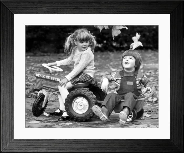 Framed Print : Young boy and girl wearing wellies. 7th October 1980
