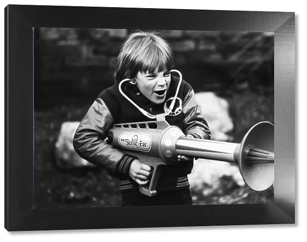 Seven year old Matthew Allen tries out his new sonic laser gun. 29th January 1979